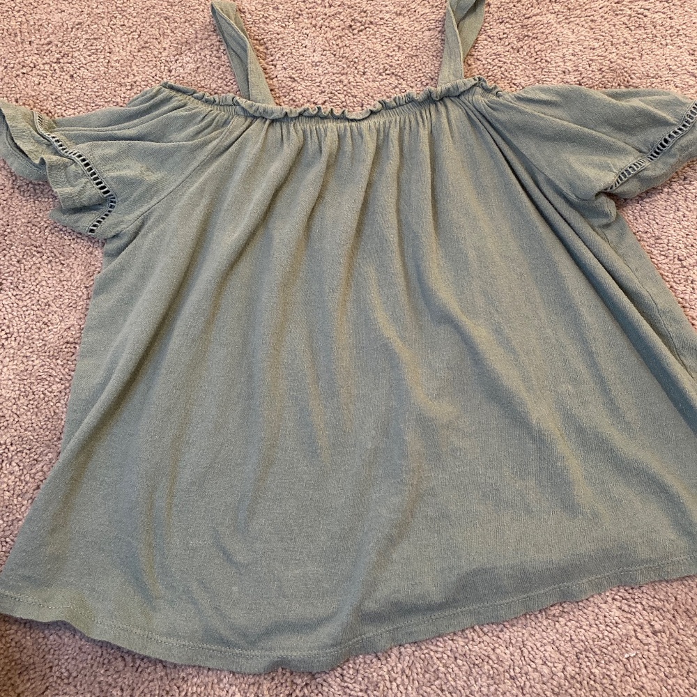 A sage green shoulder shirt